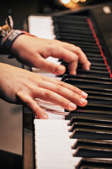 Obraz premium hands of a child playing the piano