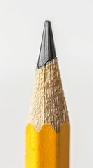 A close up image of the tip of a sharpened yellow pencil. - obrazy, fototapety, plakaty