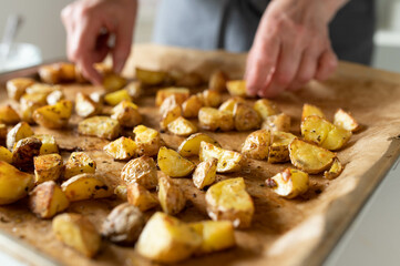 Fresh roasted potatoes on a baking sheet