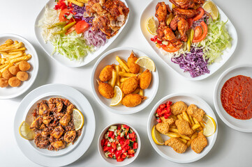 Asian food and takeaway composition from above of fried food, crab claws, plate with chicken kebabs and ingredients on white background