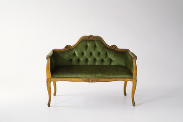An exquisite antique sofa upholstered in plush green velvet stands gracefully. The tufted backrest...