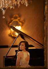 Mansion, woman and piano portrait with musician, lounge and pianist in a ballroom with luxury...