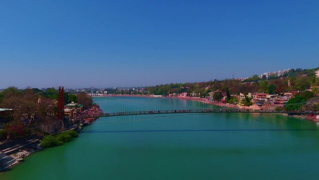 people walking in lakshman jhula bridge drone shot