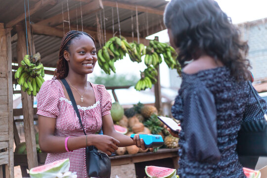 Two Young African Women Using NFC Payment Method