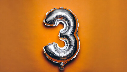 Banner with number 3 silver balloon. Three years anniversary celebration. Orange background.