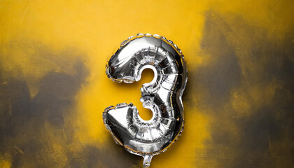 Banner with number 3 silver balloon. Three years anniversary celebration. Yellow background.