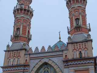 An ancient Muslim mosque with domes on the background of mountains. The mosque was built at the...