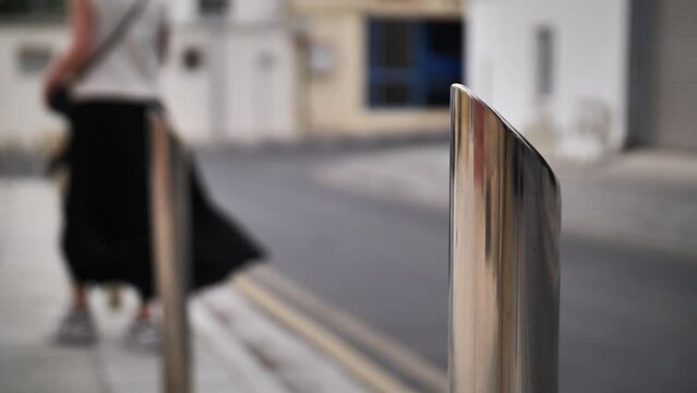 Close-up of bollards placed along the road. Metal road bollards. Road bollards made of metal.