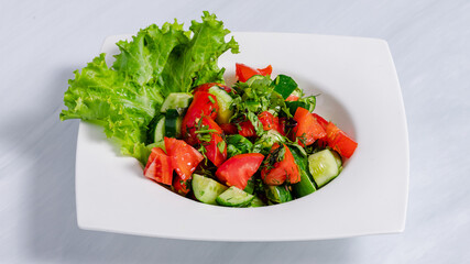 Tomato cucumber salad plate top view