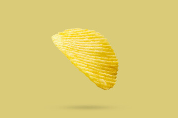 potato chip isolated on yellow background - 795402149