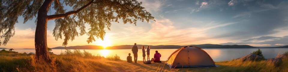 Fototapeta premium family vacation Camping with a tent amid nature at sunset Man and children near the seashore See the view at sunset
