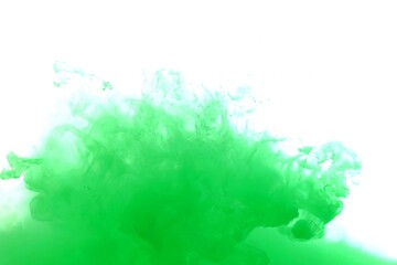 Green color dye melt on white background,Abstract smoke pattern,Colored liquid dye,Splash paint