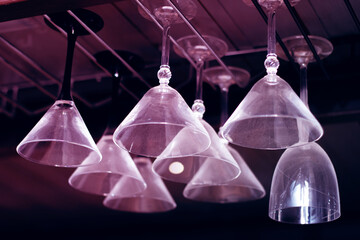 Elegant drinkware display with glass bottles hanging from ceiling