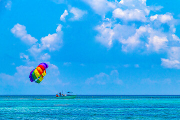 Paragliding with boat in the Caribbean in Mexico.