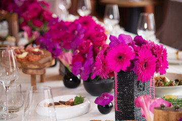 Table setting for the holiday Flowers for the holiday are red. catering