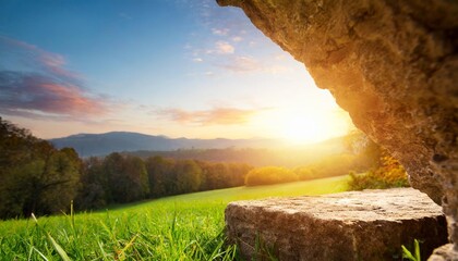 resurrection of jesus christ concept empty tomb stone and meadow autumn sunrise background