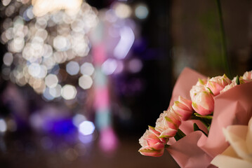 bouquet of pink roses at a party close-up