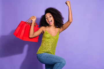 Photo portrait of gorgeous young girl hold shopping bags winning wear trendy green sequins outfit...