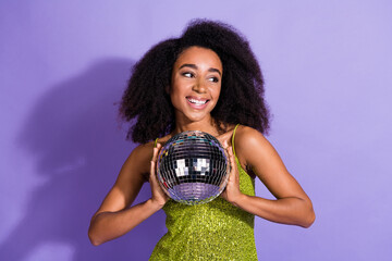 Photo of gorgeous young girl dancing hold discoball look empty space wear trendy green sequins...