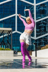 Vertical Screen: Beautiful And Stylish Young Caucasian Woman Voguing On Street. Professional Vogue Dancer Practicing Choreography In Urban Environment During The Day. Preparing For The Vogue Ball.