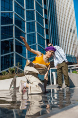 Vertical Screen: Young And Stylish Female Hip-Hop Dancer Freestyling On Street In the Circle Of...