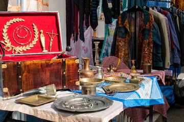 table with antique vintage items at a street fair