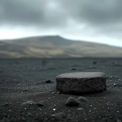 Foto op Aluminium b'A soltary rock sits in a vast field of black sand' © Adobe Contributor