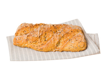 Freshly baked delicious french bread with napkin isolated on white background top view. Healthy...