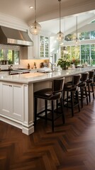 Fototapeta premium b'Kitchen island with seating and hardwood flooring'