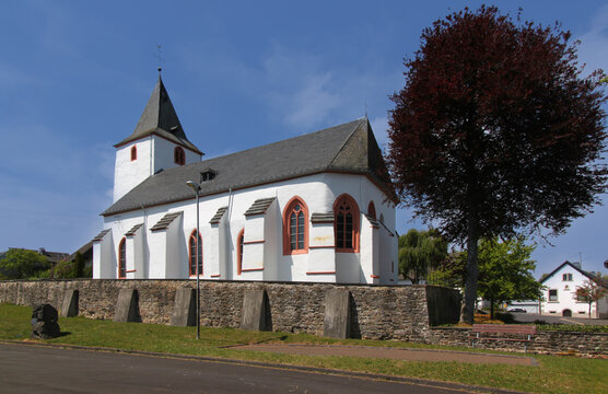 Medieval church with gothic apse in the old village of Baasem, Eifel region in Germany