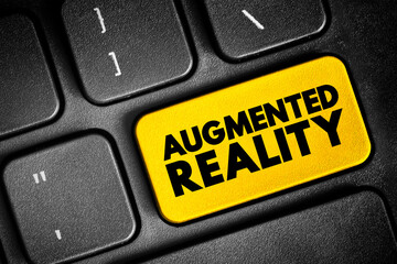 Augmented reality - interactive experience of a real-world environment where the objects that reside in the real world are enhanced by computer-generated information, text button on keyboard - 795467991