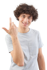 Smiling and handsome a young man with curly hair he looks into the camera with his blue eyes, gesturing with his hands, a portrait of a guy wearing a T-shirt isolated against a white background