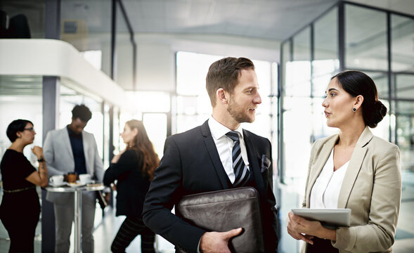 Business people, lawyer and teamwork in office with support, planning and discussion at law firm lobby. Lawyer, attorney and paralegal or clients on digital tablet for networking, talking and meeting