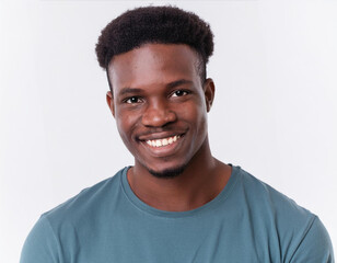 African American man on white background smiling while looking at camera. The photo is suitable for advertising, video and product presentation.