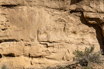 Early graffiti marked 1887 at Chaco Culture National Historical Park in New Mexico. Chaco Canyon was a major Ancestral Puebloan culture center and has many pueblos. Petroglyph trail.