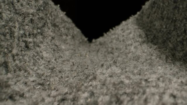 Wool textile cloth texture close-up macro. Woolen background. Fashion fabric multicolor. Sheep wool for clothes 