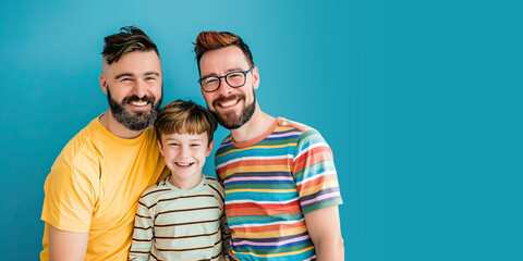 Happy Same Sex Dad Couple and Their Son on a Blue Background with Space for Copy. Fathers Day