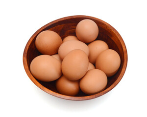 Eggs isolated in wooden bowl on white background