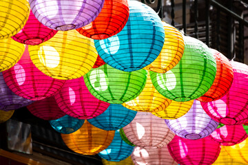 Rows of Chinese lanterns in a dark alley of Chinatown, a district of San Francisco, (USA). Typical...