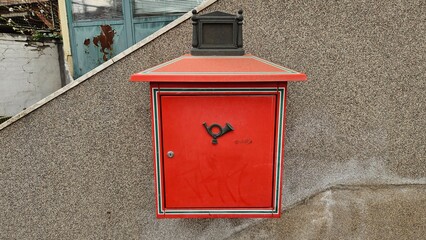 Old classic and rusty red post letter box in Budapest, Hungary