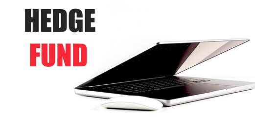 FEDGE FUND text on white background with laptop and mouse