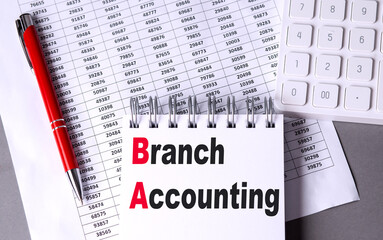BRANCH ACCOUNTING text on notebook with chart , pen and calculator