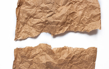 Crumpled brown paper. Background made of natural paper with tears on a white background