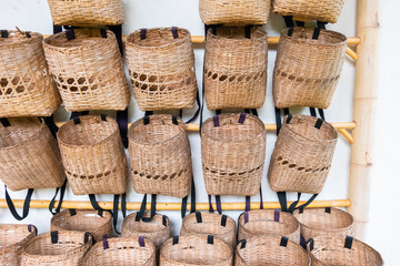 Bamboo baskets or tea storage basket hanging on a wooden railing in the tea plantation,rattan...