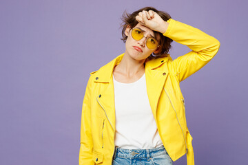 Young sad sick ill woman wears yellow shirt white t-shirt casual clothes glasses put hand on...