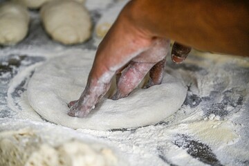 Isolated high resolution image close up of pizza preparation process- Israel
