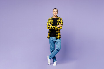 Fototapeta na wymiar Full body young smiling middle eastern man wear yellow shirt casual clothes hold hands crossed folded look camera isolated on plain pastel light purple background studio portrait. Lifestyle concept.