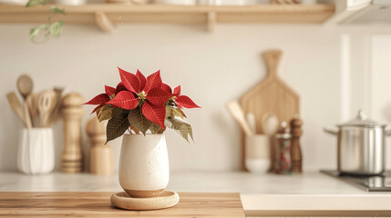 White vase with red poinsettia flowers on wooden table