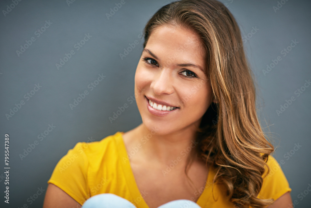 Sticker Wall, smile and woman with tshirt, portrait and relax for weekend, Gen z and streetwear for fashion in house. Grey background, happiness and girl in apartment, cheerful and comfortable in home