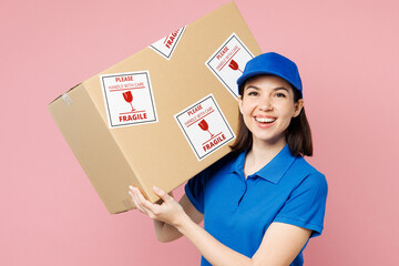 Professional delivery girl employee woman wearing blue cap t-shirt uniform workwear work as dealer...